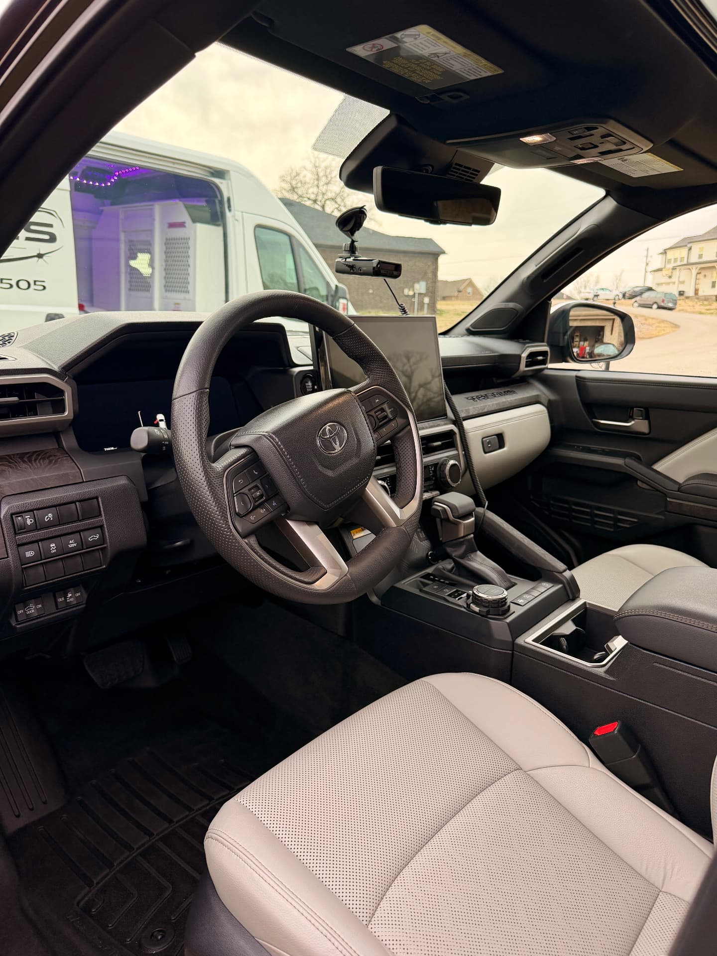 Toyota Tacoma interior detail with Laynes van in background