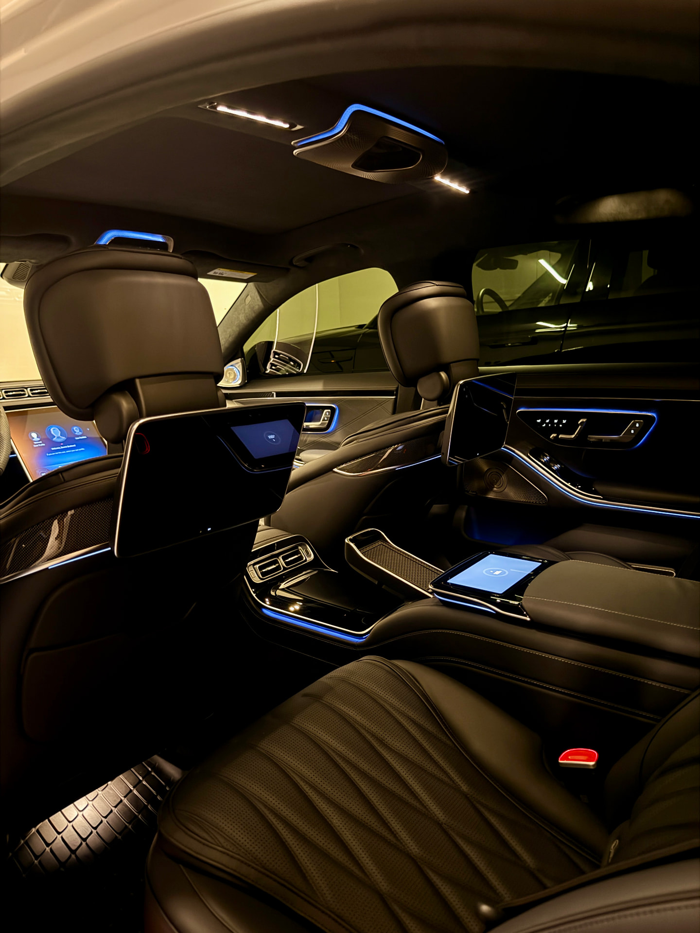 Mercedes S-Class rear cabin with screens and ambient lighting
